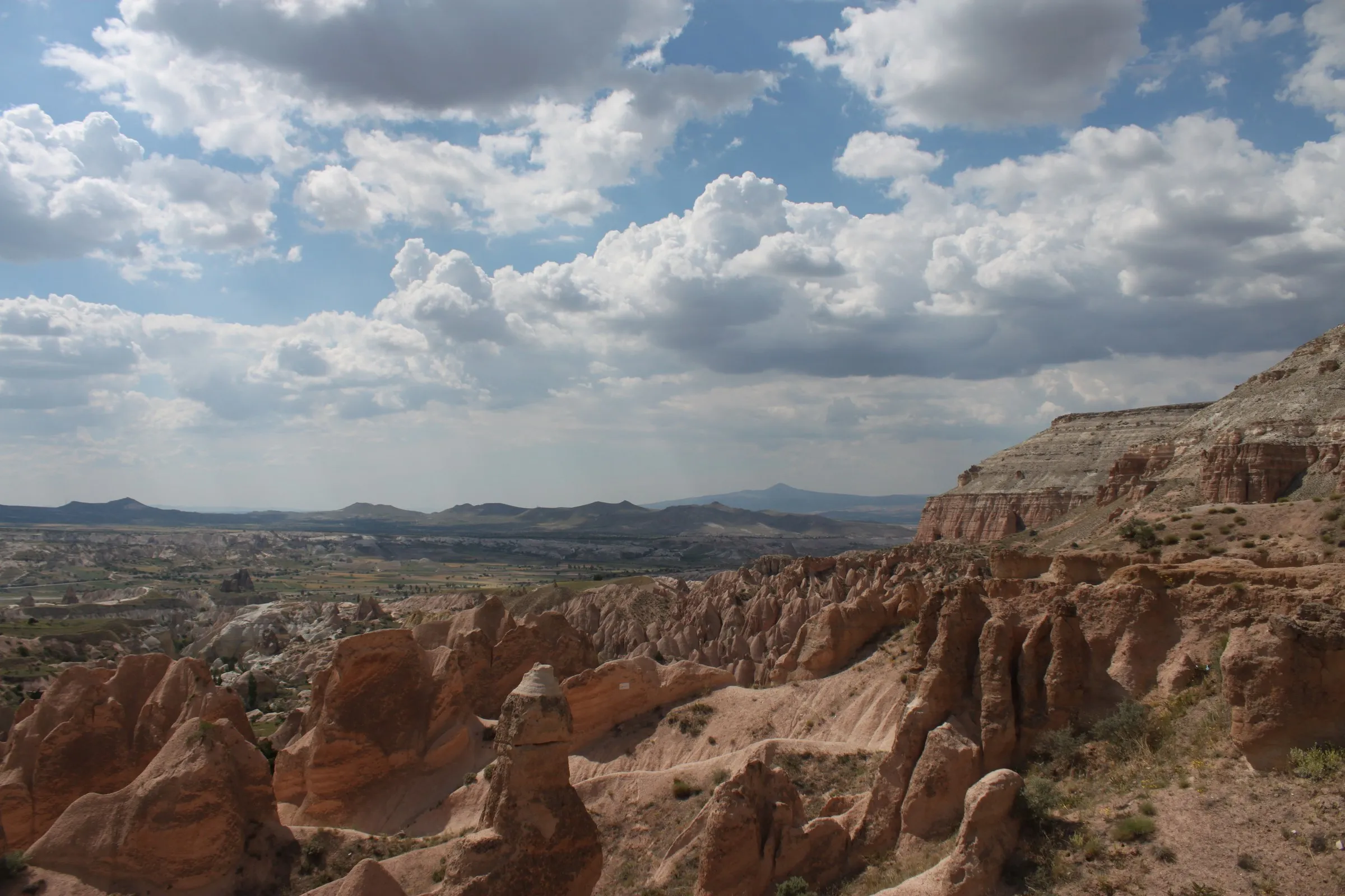 Panorama of the Red Valley's rose-coloured rock ridges, Cappadocia Panorama of the Red Valley's rose-coloured rock ridges, Cappadocia