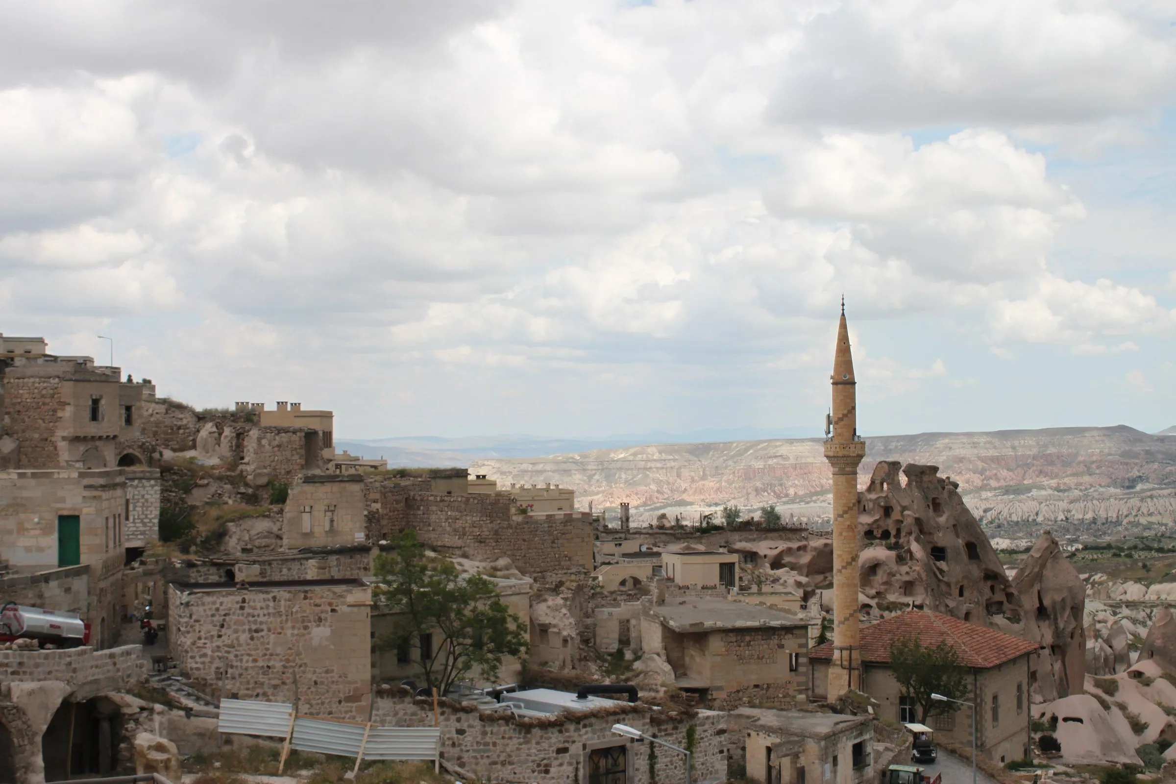 Stone houses of Uçhisar village beneath the rock castle, Cappadocia Stone houses of Uçhisar village beneath the rock castle, Cappadocia